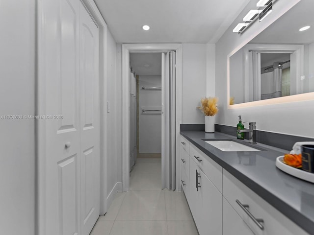 full bathroom featuring vanity, tile patterned flooring, and recessed lighting