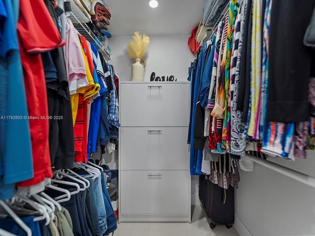 spacious closet featuring tile patterned flooring
