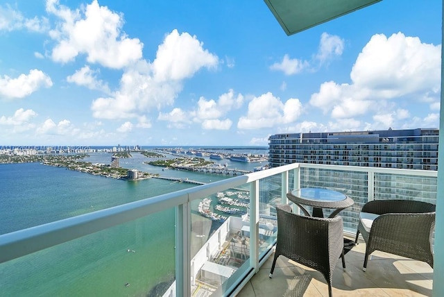 balcony featuring a water view
