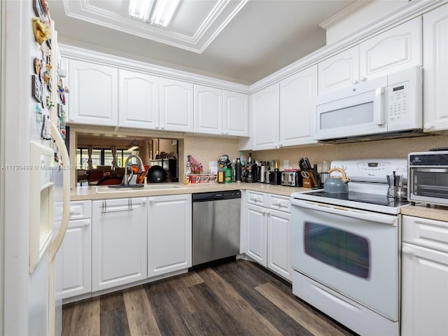 kitchen with a sink, white appliances, white cabinetry, and dark wood finished floors