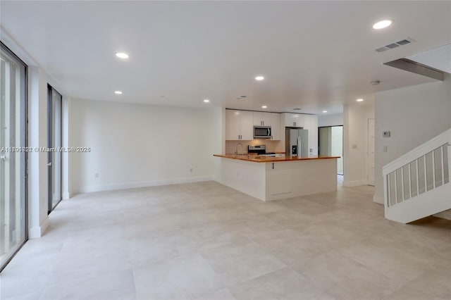 3905 Adra Ave Unit J-46B, Doral, FL 33178 - unfurnished living room featuring recessed lighting and stairs