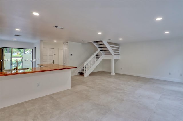 3905 Adra Ave Unit J-46B, Doral, FL 33178 - unfurnished living room featuring stairs and recessed lighting