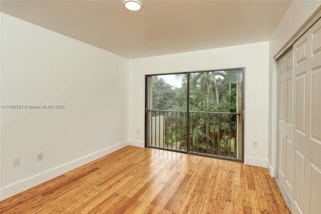 3905 Adra Ave Unit J-46B, Doral, FL 33178 - unfurnished bedroom with light wood-style floors and a closet