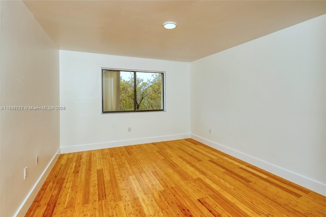 3905 Adra Ave Unit J-46B, Doral, FL 33178 - empty room featuring light wood finished floors and baseboards