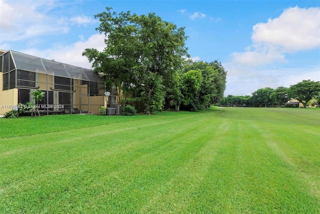 3905 Adra Ave Unit J-46B, Doral, FL 33178 - view of grassy yard featuring glass enclosure