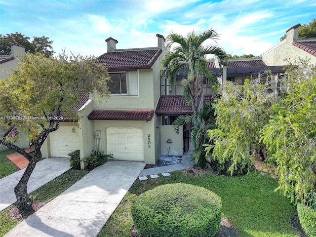3905 Adra Ave Unit J-46B, Doral, FL 33178 - mediterranean / spanish-style house featuring a tiled roof, stucco siding, concrete driveway, a chimney, and an attached garage