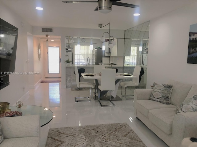 1101 Bahama Bnd Unit B2, Coconut Creek, FL 33066 - living area with visible vents, recessed lighting, marble finish floor, and ceiling fan