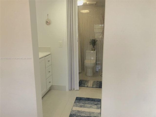 1101 Bahama Bnd Unit B2, Coconut Creek, FL 33066 - bathroom featuring toilet, tile patterned floors, walk in shower, and vanity