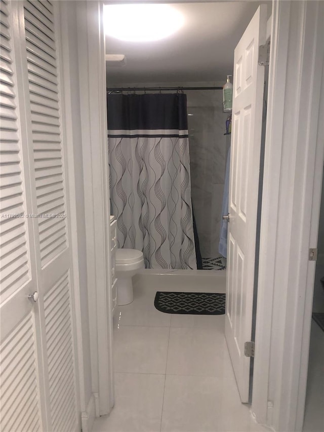 1101 Bahama Bnd Unit B2, Coconut Creek, FL 33066 - full bath with tile patterned floors, a shower with curtain, and toilet