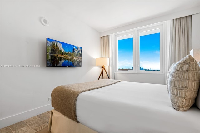 bedroom featuring baseboards