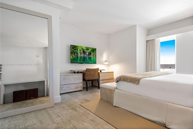 bedroom with wood finished floors