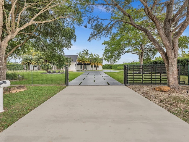 exterior space featuring a front lawn and fence