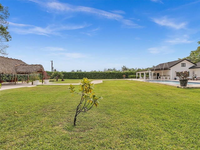 view of yard featuring a gazebo and an outdoor pool