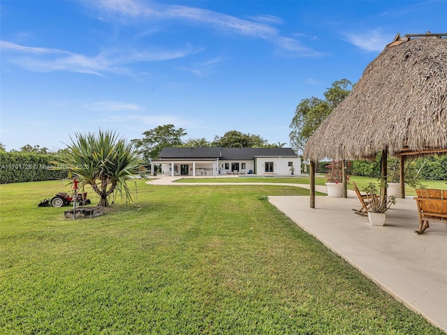 exterior space featuring a gazebo and a patio area