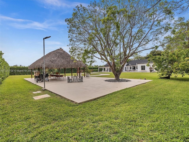 surrounding community featuring a lawn and a gazebo