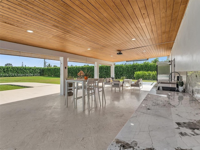 view of patio featuring outdoor dining space