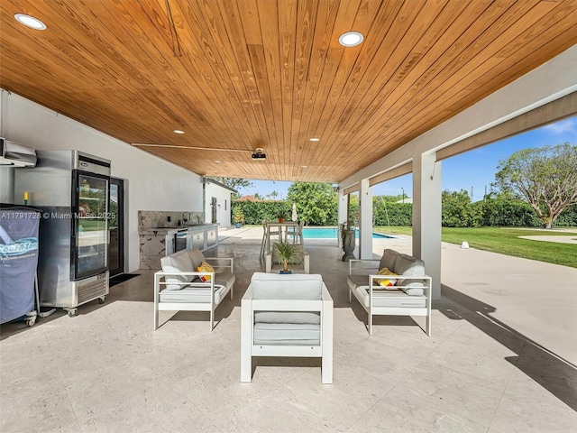 view of patio featuring a sink, an outdoor living space, and an outdoor pool