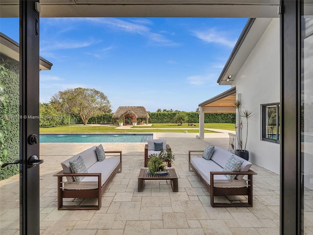 view of patio / terrace featuring an outdoor hangout area and an outdoor pool
