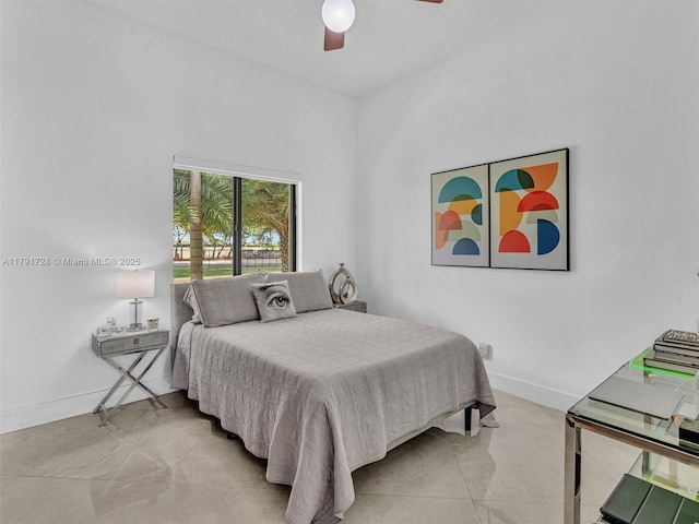 bedroom featuring ceiling fan and baseboards