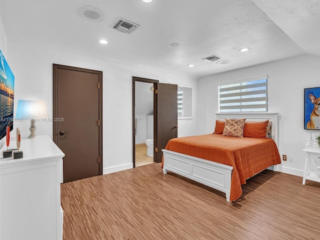 bedroom with baseboards, recessed lighting, and visible vents