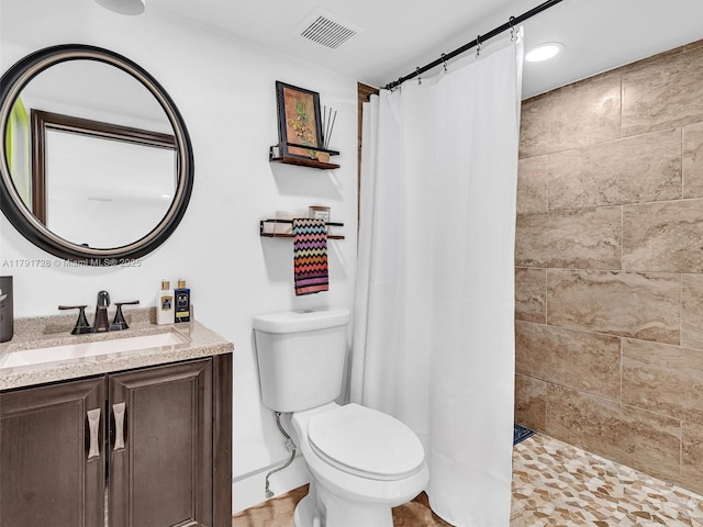 21411 SW 248th St, Homestead, FL 33031 - bathroom with a tile shower, toilet, and vanity