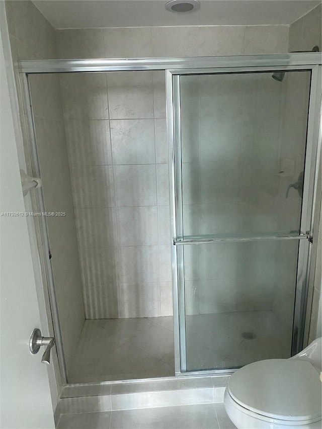 14951 Royal Oaks Ln Unit 806, North Miami, FL 33181 - bathroom with tile patterned floors, a stall shower, and toilet