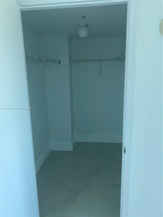 14951 Royal Oaks Ln Unit 806, North Miami, FL 33181 - walk in closet with tile patterned floors