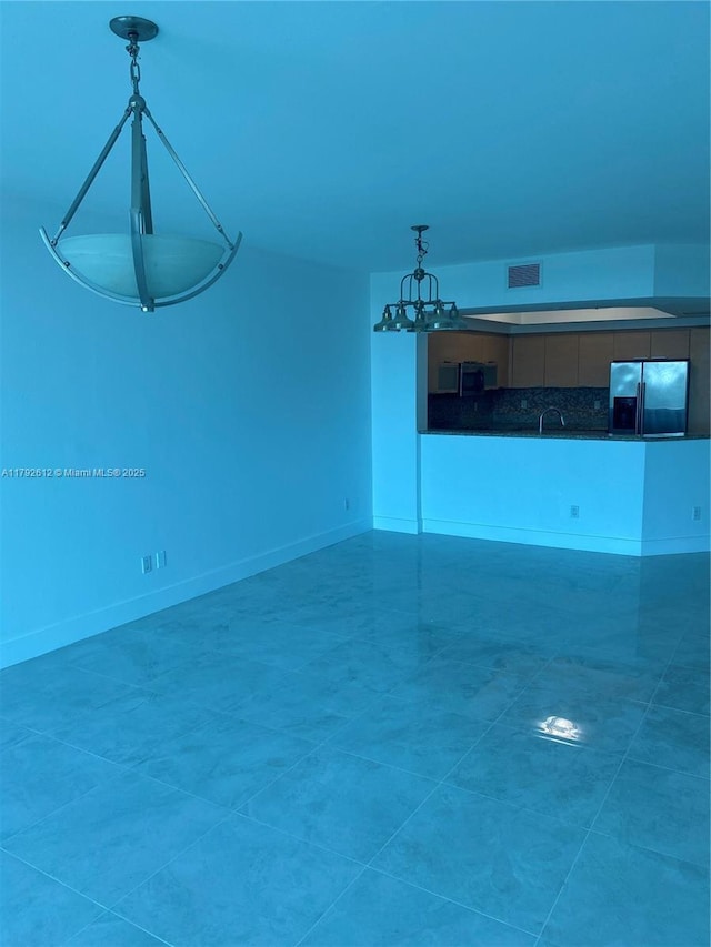 14951 Royal Oaks Ln Unit 806, North Miami, FL 33181 - unfurnished living room featuring a sink and baseboards