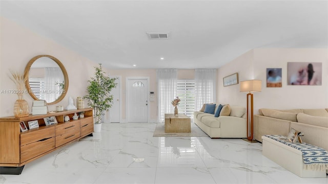 living room with recessed lighting, marble finish floor, and visible vents