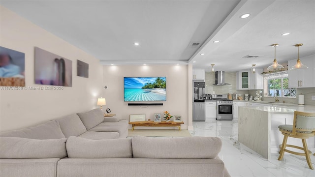 living room with visible vents, recessed lighting, and marble finish floor