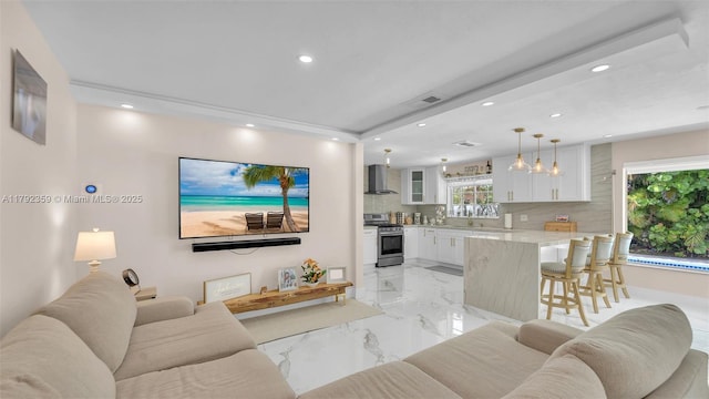 living room featuring visible vents, recessed lighting, and marble finish floor