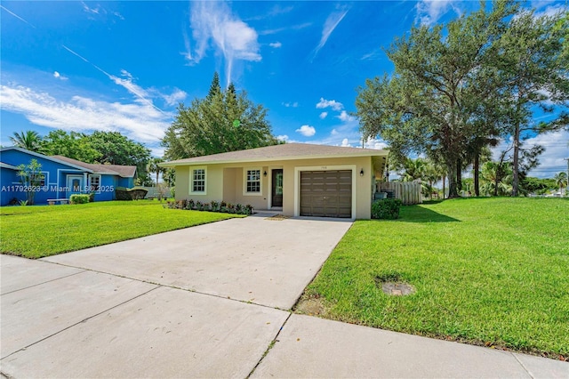 single story home with a garage, a front lawn, fence, stucco siding, and driveway