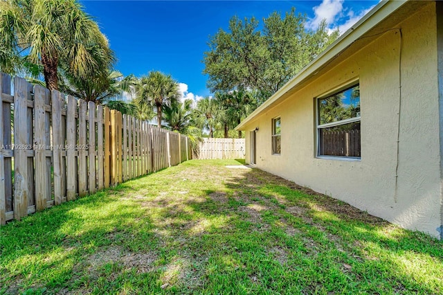 view of yard with a fenced backyard