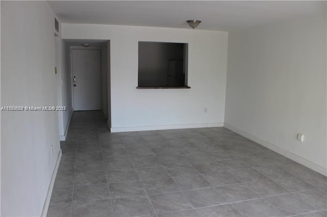 11905 NE 2nd Ave Unit C206, North Miami, FL 33161 - unfurnished room with baseboards and visible vents