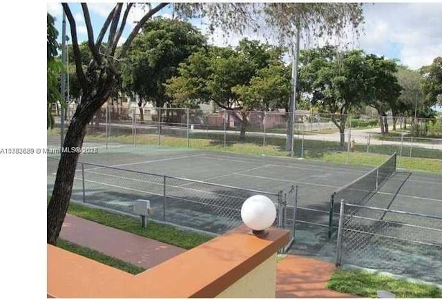 11905 NE 2nd Ave Unit C206, North Miami, FL 33161 - view of tennis court featuring fence