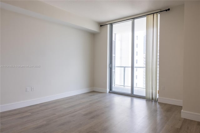 79 SW 12th St Unit 1403-S, Miami, FL 33130 - empty room with baseboards and wood finished floors