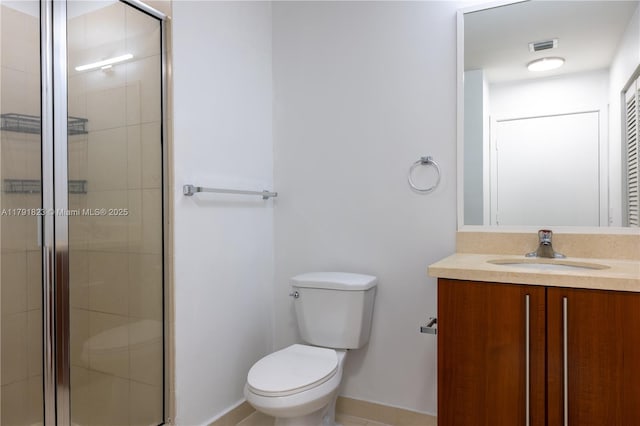 79 SW 12th St Unit 1403-S, Miami, FL 33130 - bathroom with visible vents, a shower stall, vanity, baseboards, and toilet