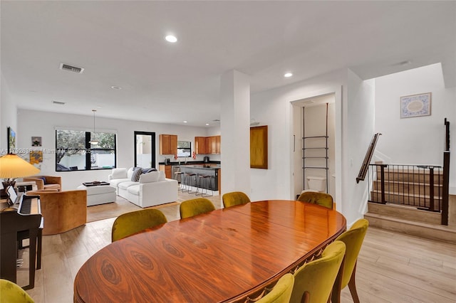 dining space featuring visible vents, recessed lighting, and light wood finished floors