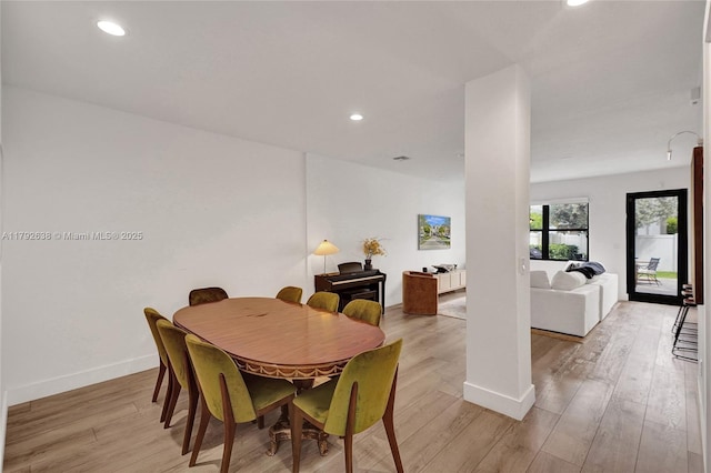 dining area featuring recessed lighting, baseboards, and light wood-style flooring