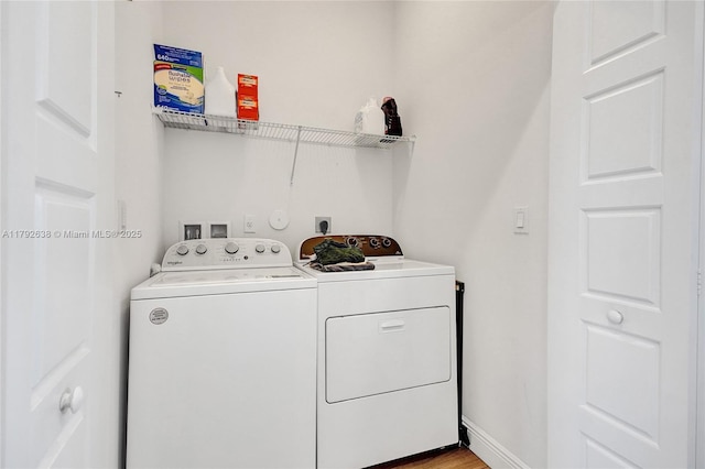 laundry area featuring washing machine and clothes dryer