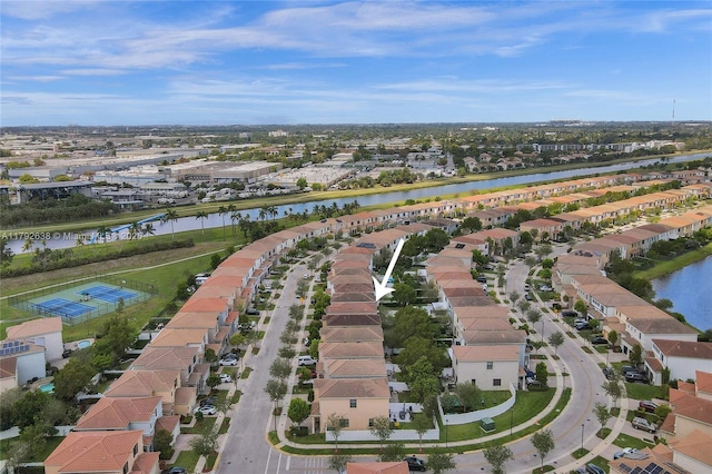bird's eye view with a residential view and a water view