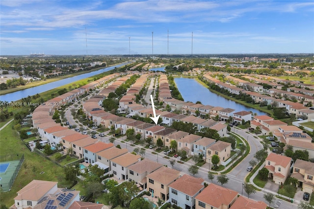 aerial view featuring a residential view and a water view