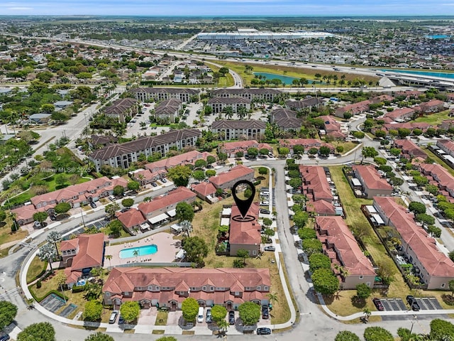 birds eye view of property featuring a water view and a residential view