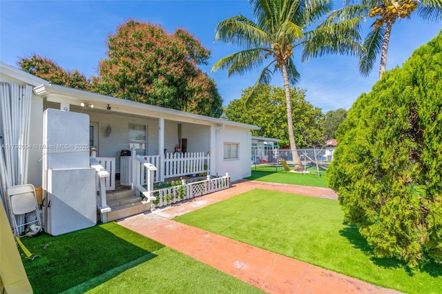 9000 NW 25th Ave, Miami, FL 33147 - view of yard with fence and covered porch