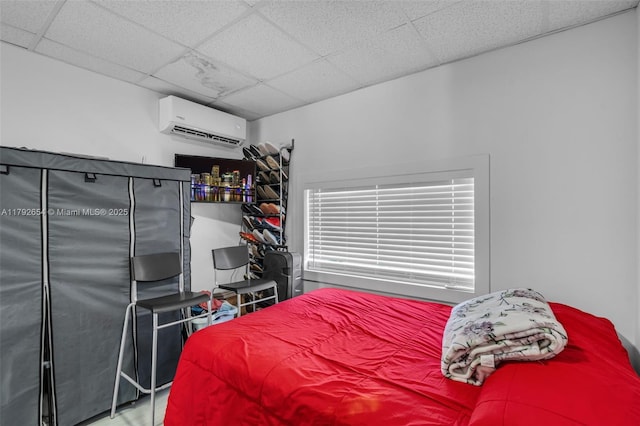 9000 NW 25th Ave, Miami, FL 33147 - bedroom featuring an AC wall unit and a paneled ceiling
