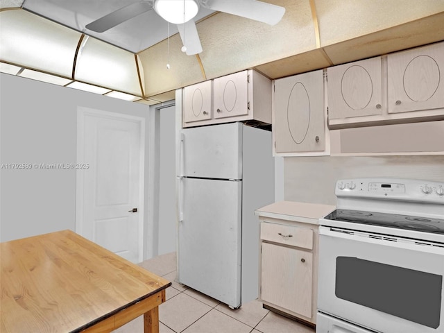 1780 NE 191st St Unit 205-2, Miami, FL 33179 - kitchen with white appliances, ceiling fan, light tile patterned floors, and light countertops