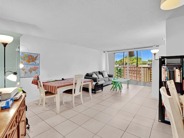 1780 NE 191st St Unit 205-2, Miami, FL 33179 - living room with light tile patterned flooring and a textured ceiling