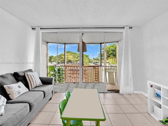 1780 NE 191st St Unit 205-2, Miami, FL 33179 - living area featuring a textured ceiling, floor to ceiling windows, and light tile patterned floors