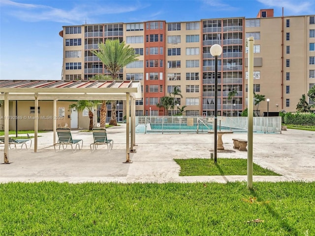 1780 NE 191st St Unit 205-2, Miami, FL 33179 - exterior space featuring a swimming pool, fence, and a patio