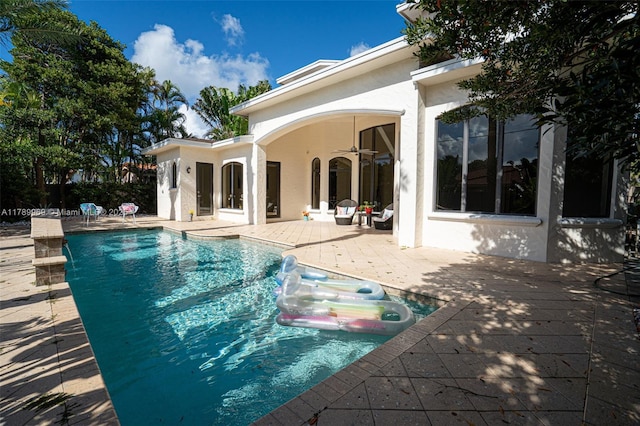 260 NE Wavecrest Ct, Boca Raton, FL 33432 - outdoor pool with a patio and ceiling fan